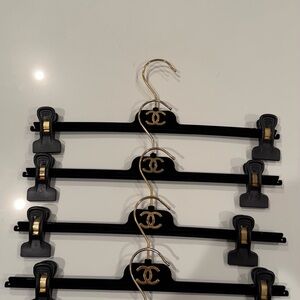 CHANEL Elegant Black and Gold Hangers